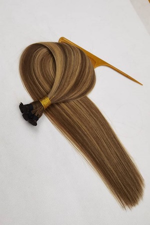 A Tuft of Light Brown Human Hair Extensions